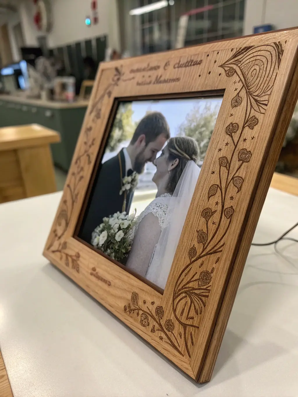 A personalized engraved photo frame with a heartfelt message, surrounded by other customized gift items.
